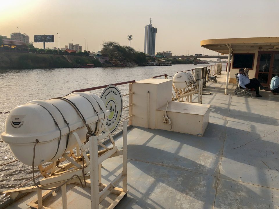 The Blue Nile in Khartoum at dusk, with the city skyline behind